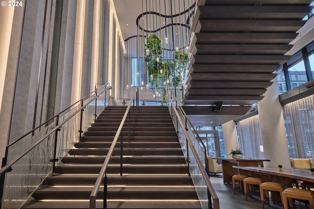 stairway featuring a high ceiling