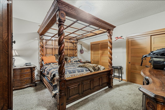 carpeted bedroom with a textured ceiling