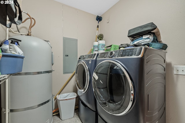 washroom with electric panel and washer and dryer