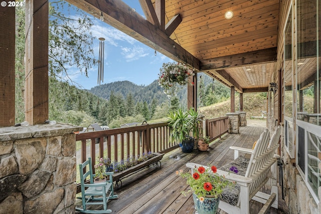 wooden deck with a mountain view