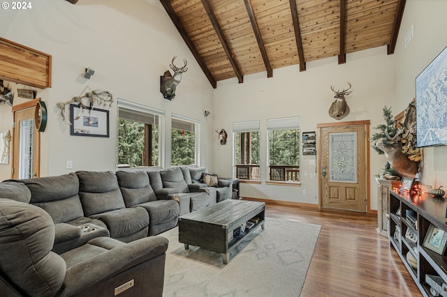 living room with light hardwood / wood-style flooring, beam ceiling, high vaulted ceiling, and wooden ceiling