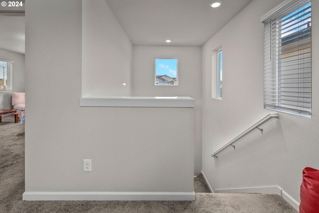 stairs with carpet, baseboards, and recessed lighting