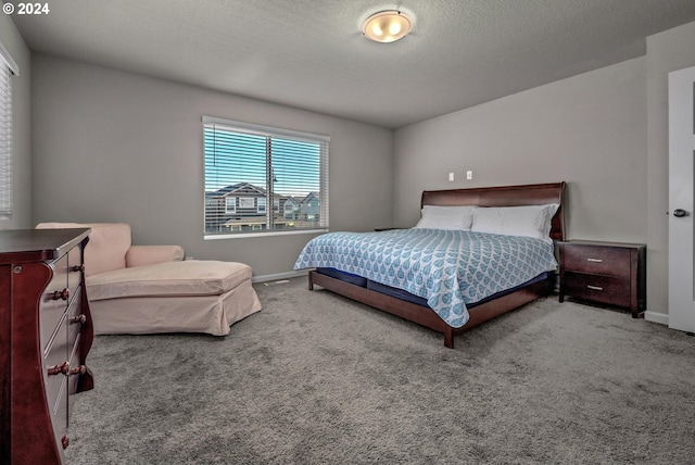 carpeted bedroom with a textured ceiling