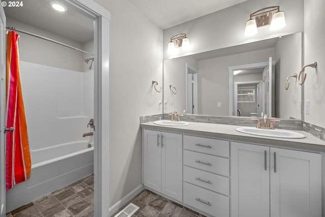 bathroom featuring vanity and shower / tub combo with curtain