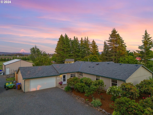 ranch-style home with a mountain view and a garage