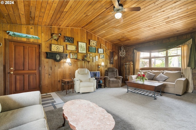 living room featuring ceiling fan, carpet flooring, wood ceiling, wooden walls, and lofted ceiling