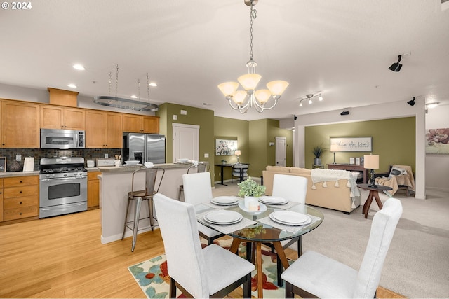 8844 NE Brentford Way, Hillsboro, OR 97006 - dining area featuring a chandelier and light hardwood / wood-style floors