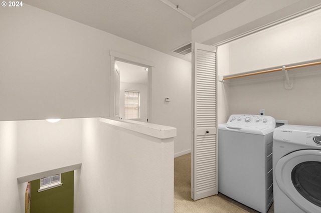 8844 NE Brentford Way, Hillsboro, OR 97006 - washroom with washer and clothes dryer and light colored carpet