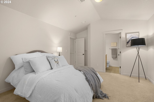 8844 NE Brentford Way, Hillsboro, OR 97006 - bedroom with light carpet, connected bathroom, and lofted ceiling