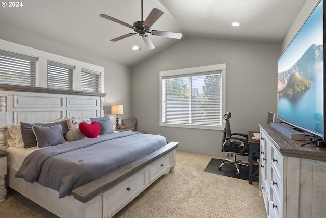 bedroom with ceiling fan, lofted ceiling, and light carpet