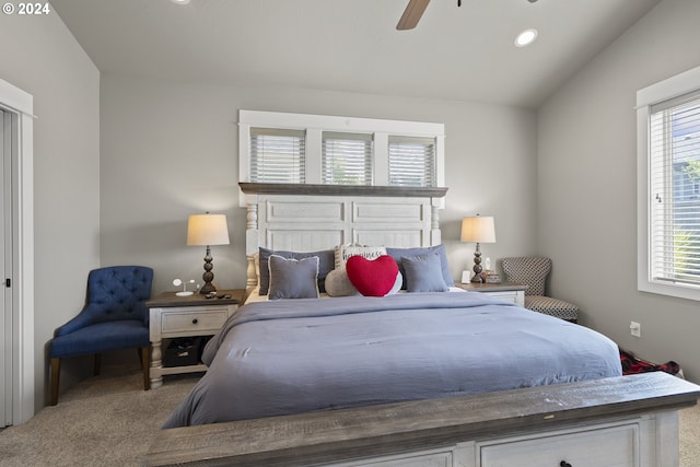 bedroom featuring ceiling fan, lofted ceiling, and carpet