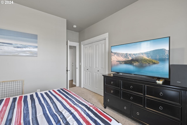 carpeted bedroom with a closet