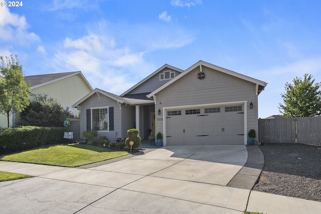 view of front facade featuring a garage and a front yard