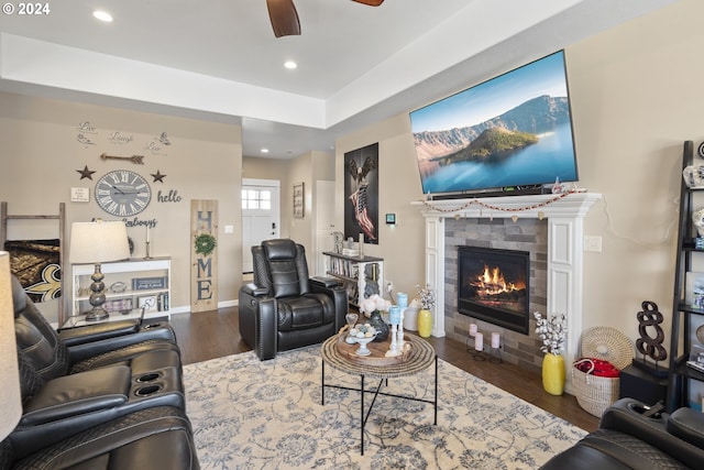 living room with hardwood / wood-style floors and ceiling fan