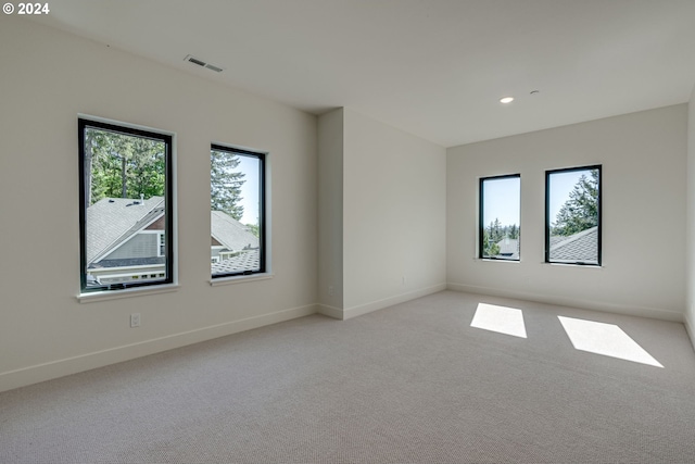 spare room with light colored carpet