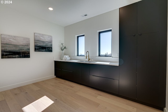 bathroom featuring vanity and hardwood / wood-style flooring