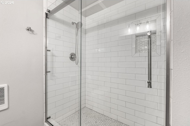 bathroom featuring a shower stall