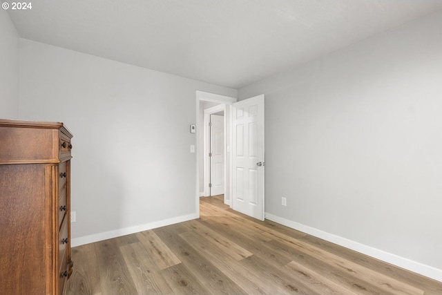 unfurnished room with light wood-type flooring