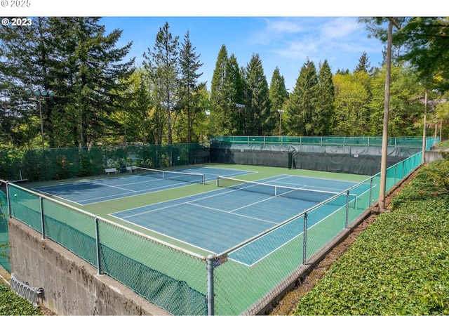 view of tennis court with fence