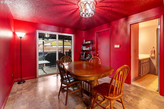 dining space featuring a textured ceiling