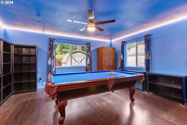 rec room featuring a textured ceiling, dark hardwood / wood-style flooring, ceiling fan, and billiards