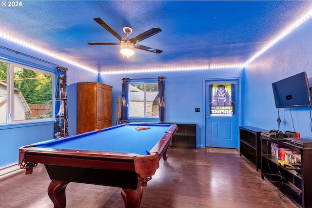 playroom featuring ceiling fan, dark hardwood / wood-style flooring, a textured ceiling, and pool table