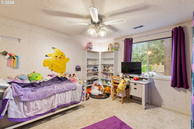 bedroom featuring a textured ceiling, ceiling fan, and light carpet