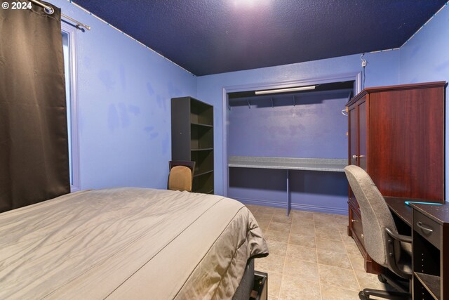 bedroom featuring a textured ceiling