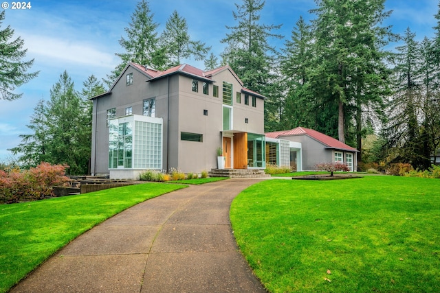 contemporary house featuring a front lawn