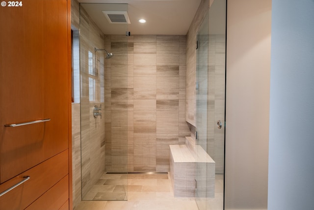 bathroom featuring recessed lighting, visible vents, and a stall shower