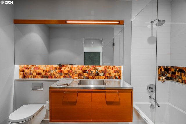 full bathroom featuring toilet, shower / bathing tub combination, vanity, and decorative backsplash