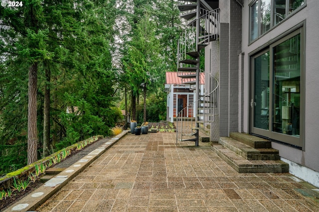 view of patio / terrace featuring stairway and entry steps