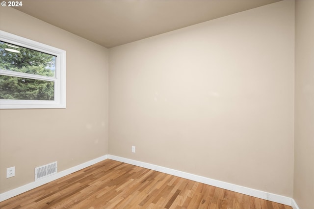 empty room featuring hardwood / wood-style flooring