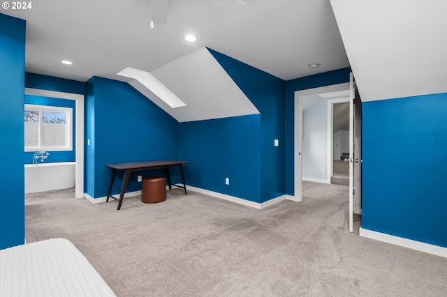 additional living space with lofted ceiling and light carpet