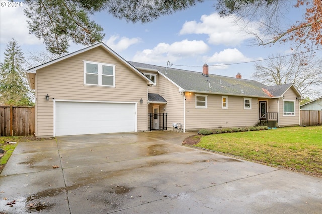 view of front facade featuring a front lawn and a garage