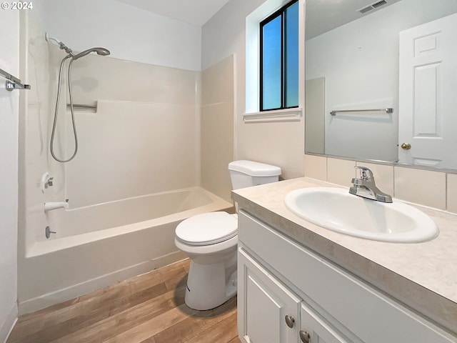 full bathroom with vanity, toilet, shower / washtub combination, and wood-type flooring