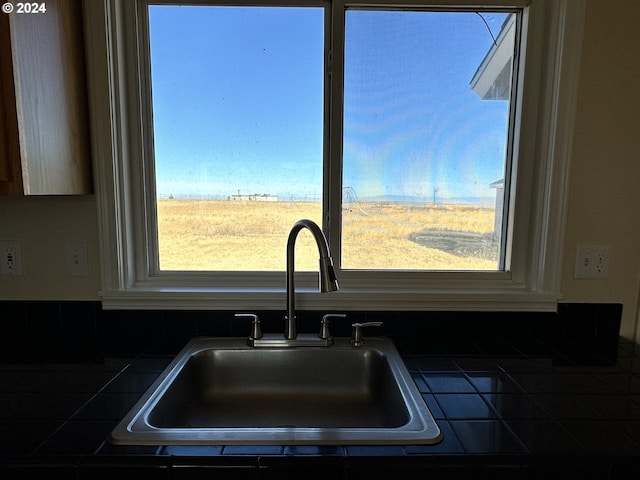 interior details with sink and tile countertops