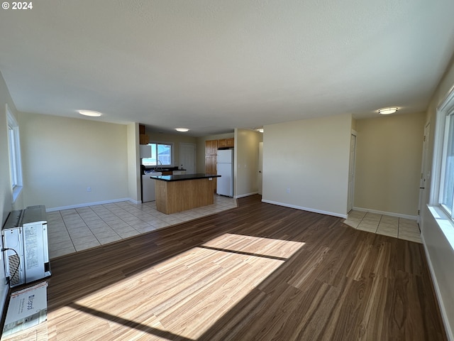14865 Mt View Dr, Condon, OR 97823 - unfurnished living room featuring light wood-type flooring and baseboards