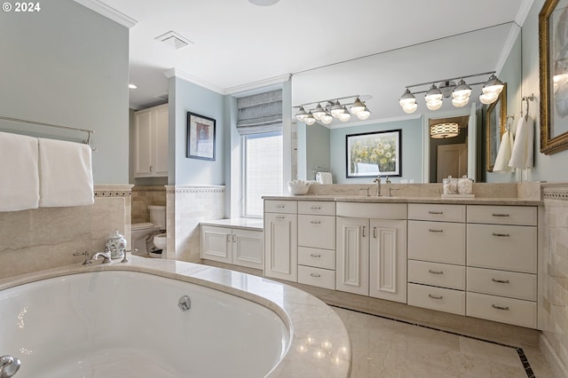 bathroom featuring a washtub, vanity, ornamental molding, and toilet