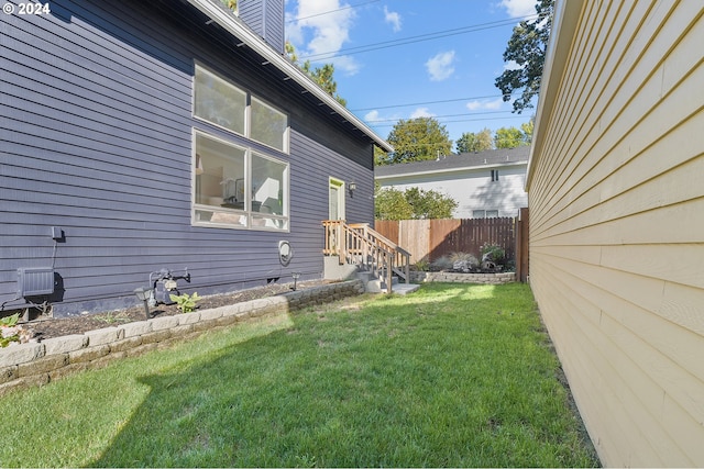 view of home's exterior with a yard