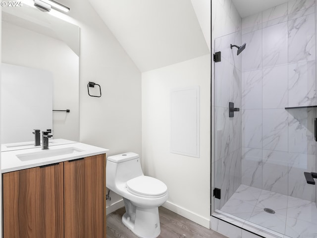 bathroom featuring vanity, lofted ceiling, toilet, an enclosed shower, and wood-type flooring