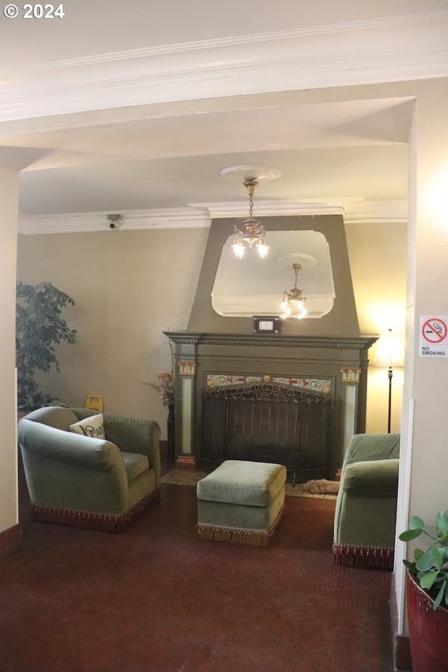 sitting room with ornamental molding and a chandelier