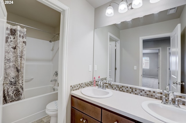 full bathroom with oversized vanity, shower / bath combination with curtain, toilet, tasteful backsplash, and double sink