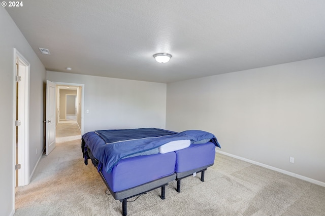 bedroom with light colored carpet