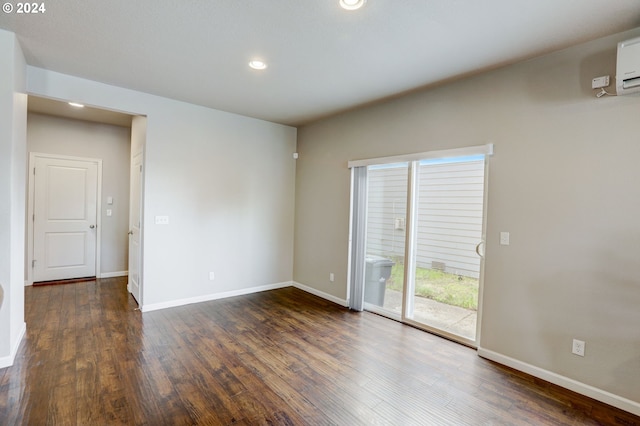 spare room featuring dark hardwood / wood-style flooring