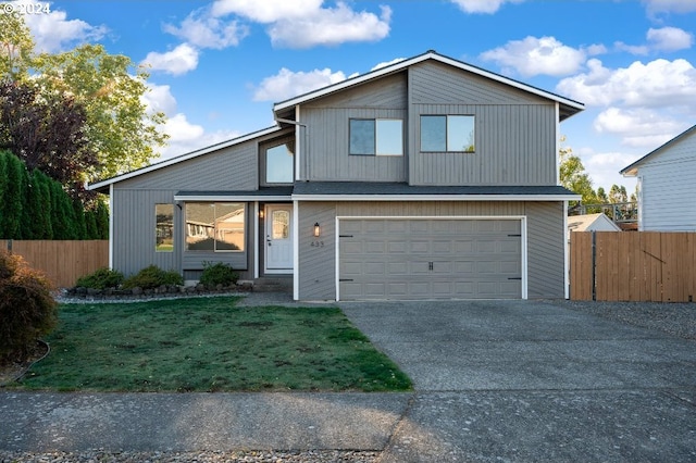 view of front facade with a front lawn and a garage