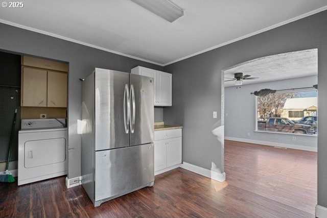 kitchen featuring washer / clothes dryer, white cabinets, stainless steel fridge, and dark hardwood / wood-style flooring