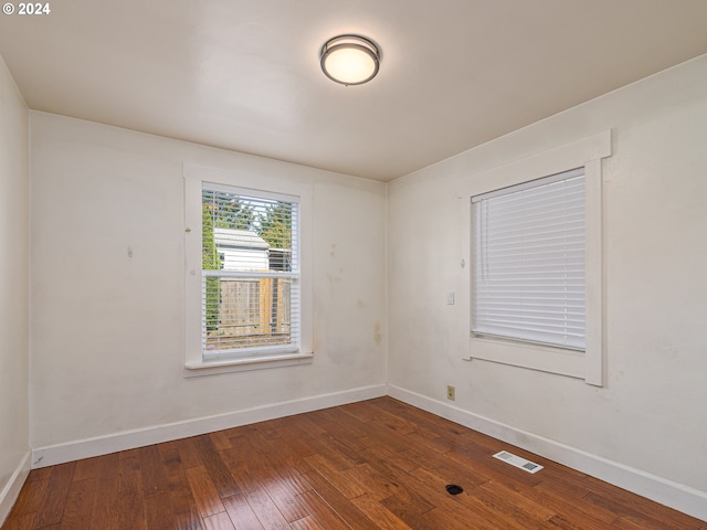 unfurnished room featuring hardwood / wood-style floors