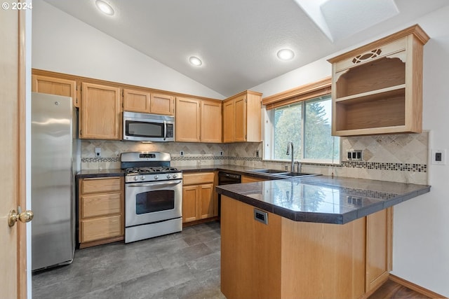 kitchen featuring tasteful backsplash, kitchen peninsula, vaulted ceiling, and appliances with stainless steel finishes