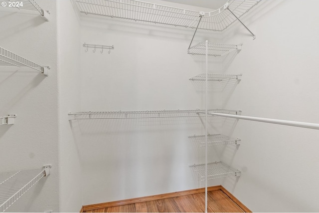 walk in closet featuring hardwood / wood-style floors